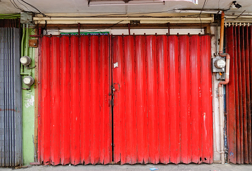 Manila, Philippines - Dec 20, 2015. Red steel door at Chinatown in Manila, Philippines.