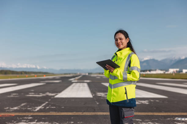 istock Happy Female Airport Worker Holding A Digital Tablet 1626762964