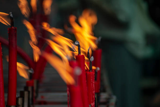 istock Red candles are lit for worship and blurred background. 1626771444