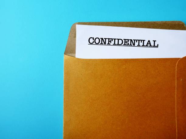 istock Office envelope with document typed CONFIDENTIAL, concept of data or information intended to be kept secret, secret or private, business or military top secret document 1626773054