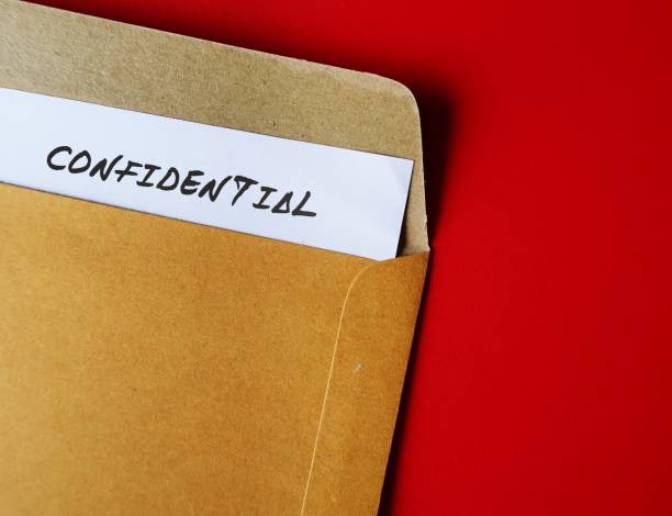 istock Office envelope with document typed CONFIDENTIAL, concept of data or information intended to be kept secret, secret or private, business or military top secret document 1626773055