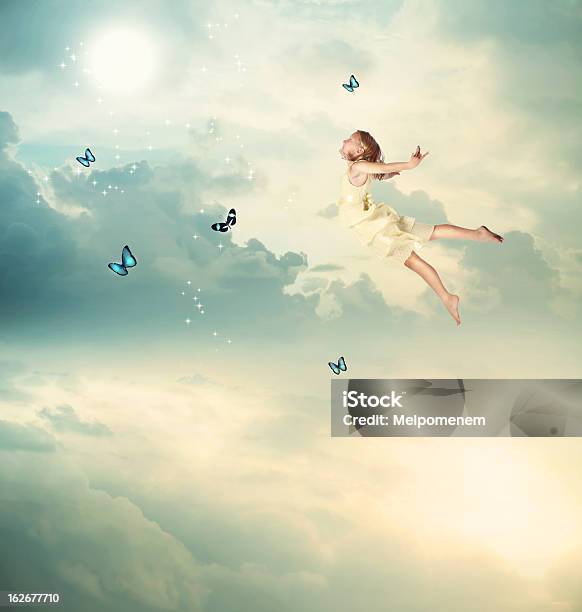 Little Girl Flying At Twilight Stock Photo - Download Image Now - Child, Flying, Night