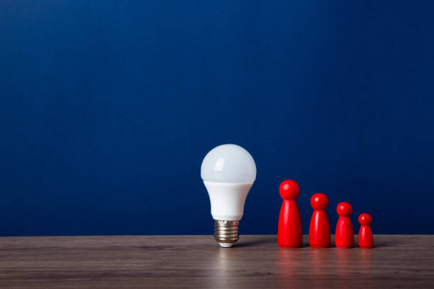 istock A light bulb and a wooden doll on the desk 1626795851