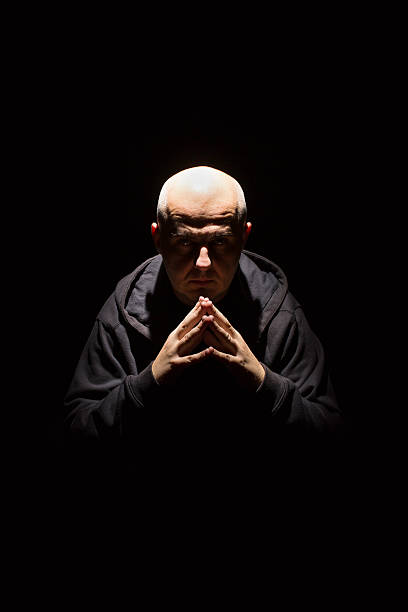 man in black a man alone in the dark  skinhead haircut stock pictures, royalty-free photos & images