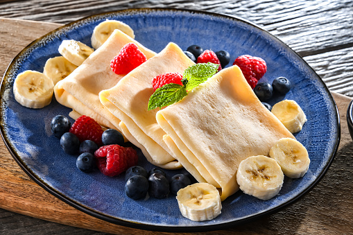 A plate of home-made Polish pancakes filled with sweet cottage cheese