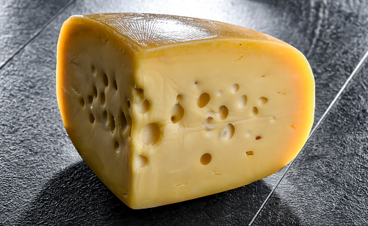 A yellow, medium-hard cheese, classified as a Swiss-type or Alpine cheese