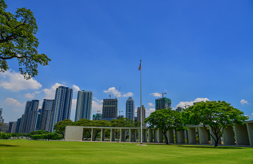 Manila, Philippines - Apr 13, 2017. Manila American Cemetery with cityscape. Cemetery honors the American and allied servicemen who died in World War II.