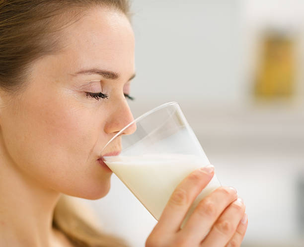 istock Closeup on young woman drinking milk 162681383