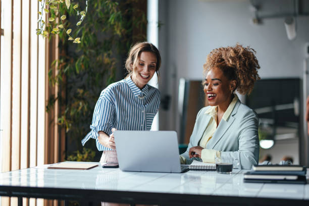 istock Two Blonde Happy Businesswomen Working In The Office Using Their Computer 1626848389