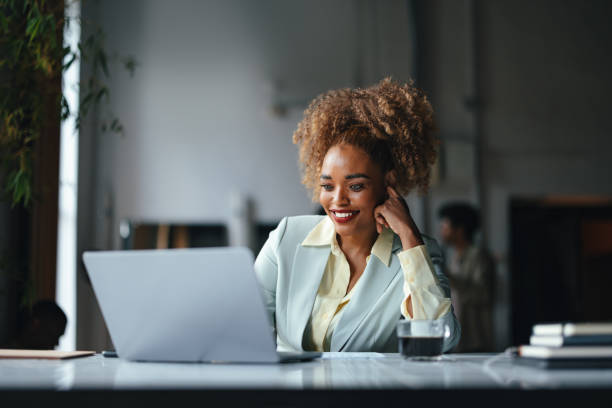 A Beautiful Blonde Cuban Businesswoman Working On Her Computer