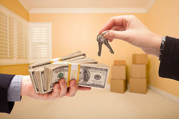 istock Handing Over Cash For House Keys 162686165