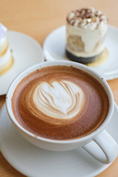 istock hot mocha on wooden table with cake 1626862427