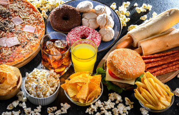 Foods enhancing the risk of cancer. Junk food Foods enhancing the risk of cancer. Junk food saturated fat stock pictures, royalty-free photos & images