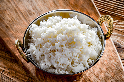 A bowl of freshly cooked basmati rice.