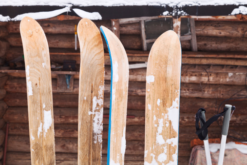 two pairs of wide wooden hunting skis