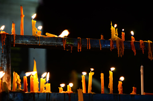 Candle sacrificial offerings for thai people and foreign travel visit travelers respect praying Mangrai statue or Mengrai monument wish holy mystery worship at Chiangrai city in Chiang Rai, Thailand