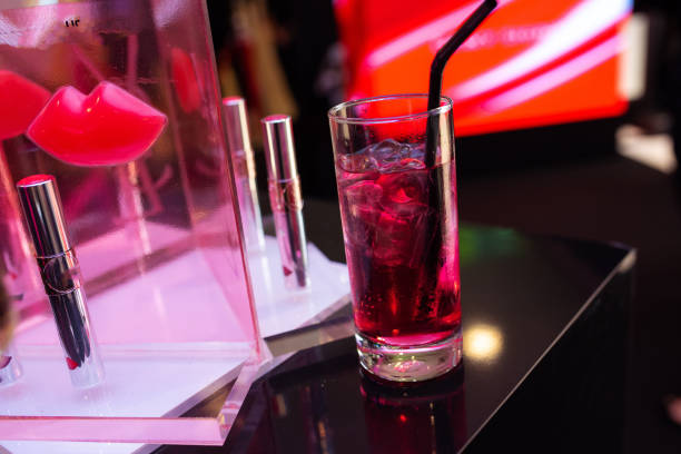 istock Red Clear Iced Cocktail next to lipstic Display 1626898619