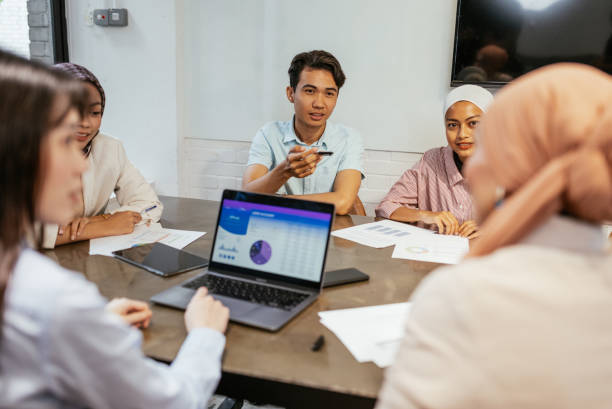 istock Teamwork in modern office, people sitting in meeting room 1626904445