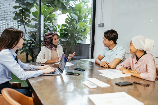 Group of multi ethnic business people and entrepreneurs working together in office