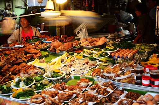 Hawker stall variety local traditional thai food northern lanna style and vegetables at street bazaar local market for travelers travel visit and eat drink on February 22, 2015 in Chiang Rai, Thailand