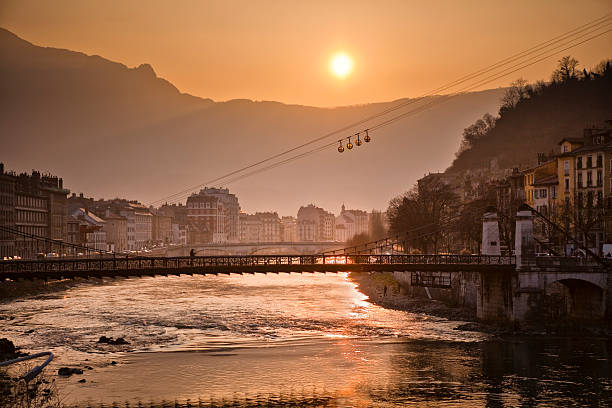 Isere River in Grenoble Isere river in Grenoble in the French Alpes. isere river stock pictures, royalty-free photos & images