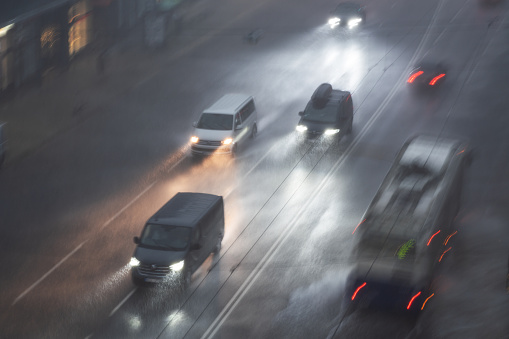 driving in dangerous conditions on a wet road