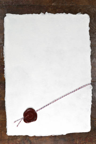 handmade paper with wax seal  on wooden table