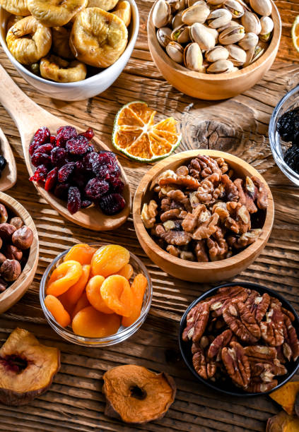 istock Composition with a variety of dried fruits and assorted nuts. 1626928805