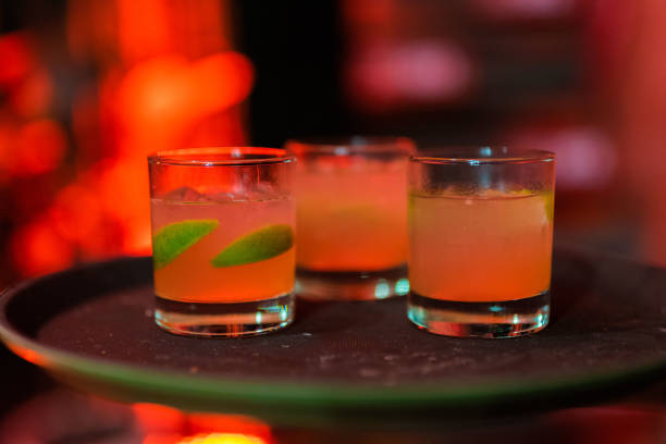 istock Cocktail Served on Tray in Red Nightclub 1626960888