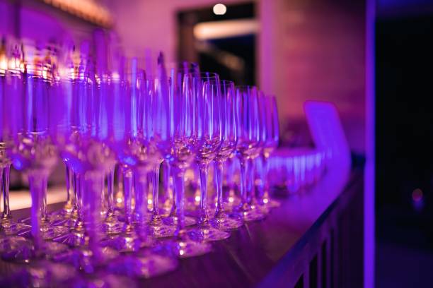 istock Row of Champagne Flutes On Bar Counter 1626971321