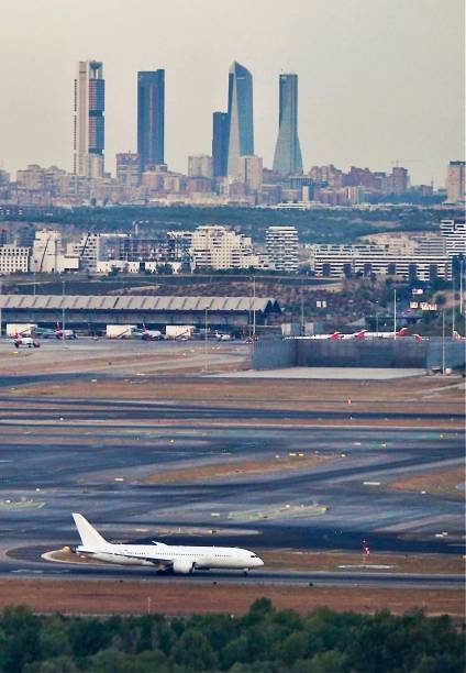 istock Plane taking off from Madrid Barajas with skyscrapers in the background 1626982421