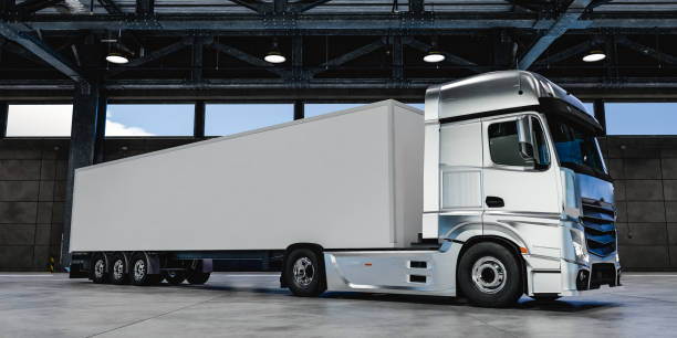 istock Modern truck with white trailer in warehouse 1626988460