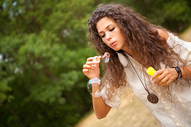 istock Girl and soap bubbles 162699366