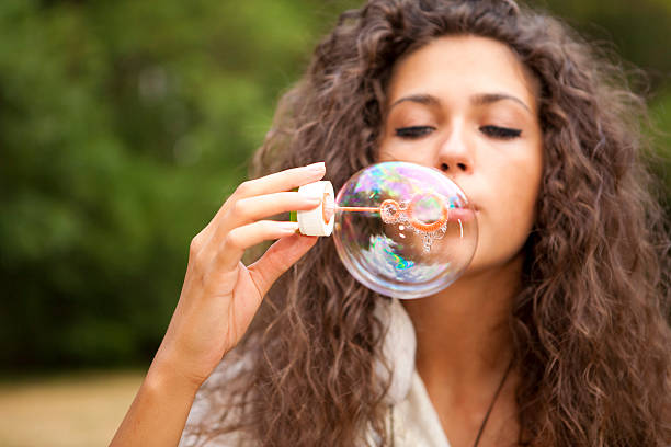 istock Girl and soap bubbles 162699390