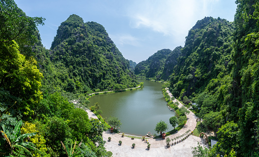 trang an lake also considered halong bay, is a beautiful limestone mountains surrounded landscape