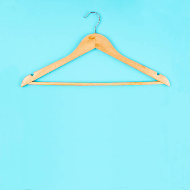 istock The Cloth hanger made from wooden on blue background with empty space for your design. 1627012879