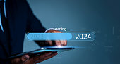 The virtual download bar with loading progress bar for New Year's Eve and changing the year 2023 to 2024. The new year 2024 is loading, calendar date, end of the year, Countdown to 2024 concept