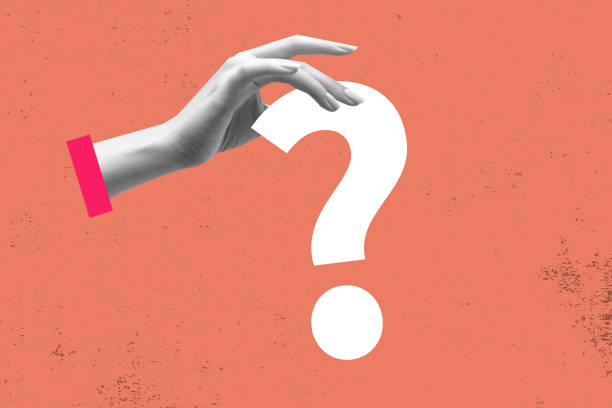 istock Female hand finger holding white question mark. Contemporary art 1627027161
