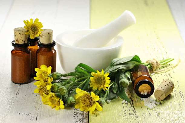 istock homeopathic arnica pills in brown bottles 1627045739