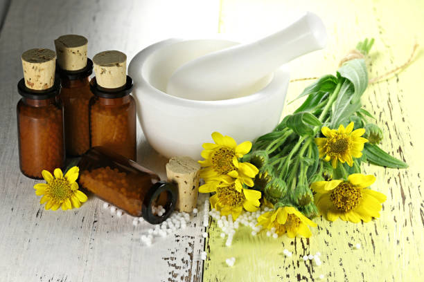 istock homeopathic arnica pills in brown bottles 1627045951