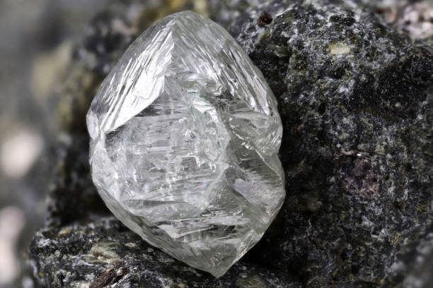 istock natural diamond nestled in kimberlite 1627047726