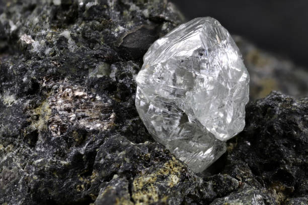 istock natural diamond nestled in kimberlite 1627047776
