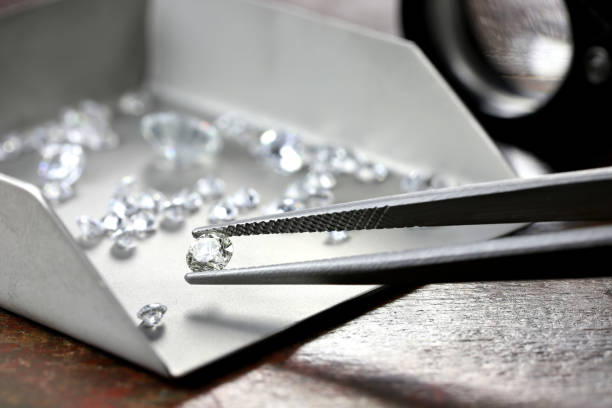 brilliant cut diamond held by tweezers brilliant cut diamond held by tweezers Diamond Suppliers stock pictures, royalty-free photos & images