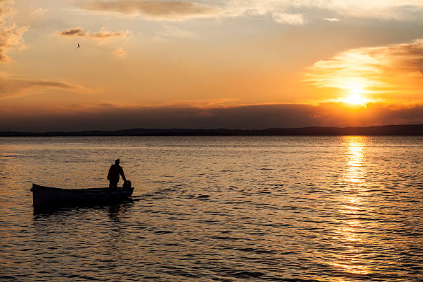 istock Return of fisherman at sunset 162705237