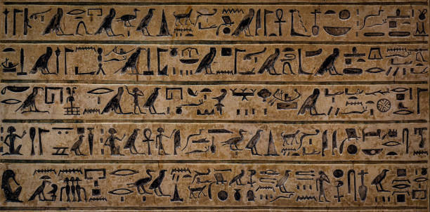istock Old Egyptian hieroglyphs on an ancient background. Wide historical background. Ancient Egyptian hieroglyphs as a symbol of the history of the Earth. 1627052820