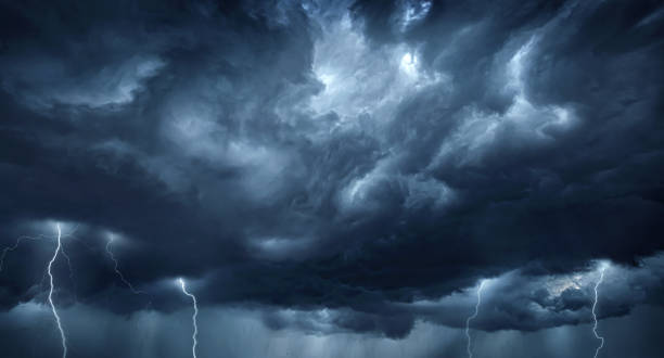 istock Thunderous dark sky with black clouds and flashing lightning. Panoramic view. Concept on the theme of weather, natural disasters, storms, typhoons, tornadoes, thunderstorms, lightning, lightning. 1627054537