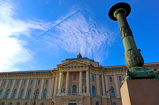 Old public educational building is located on Universitetskaya Embankment near the Neva River. St. Petersburg, Russia - April 13, 2023.