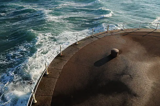Wide angle image of the end of the breakwater on a windy Winters day.