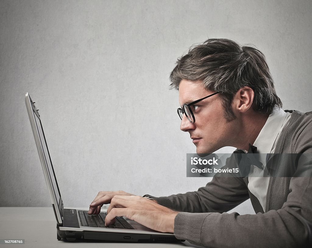concentration young man working with laptop Adult Stock Photo