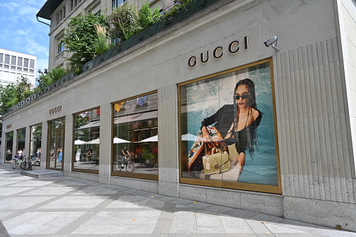 Zurich, Switzerland 07 08 2023: Show window of boutique Gucci with Italian luxury goods such as handbags, shoes and accessories, makeup, fragrances, and home decoration is situated in downtown Zurich.